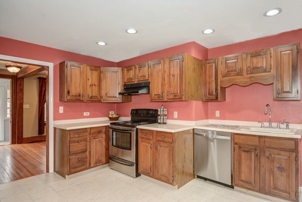 188 Shirley Road Lancaster, MA 01523 - Photo 5 of 27 a kitchen with a sink stove and cabinets