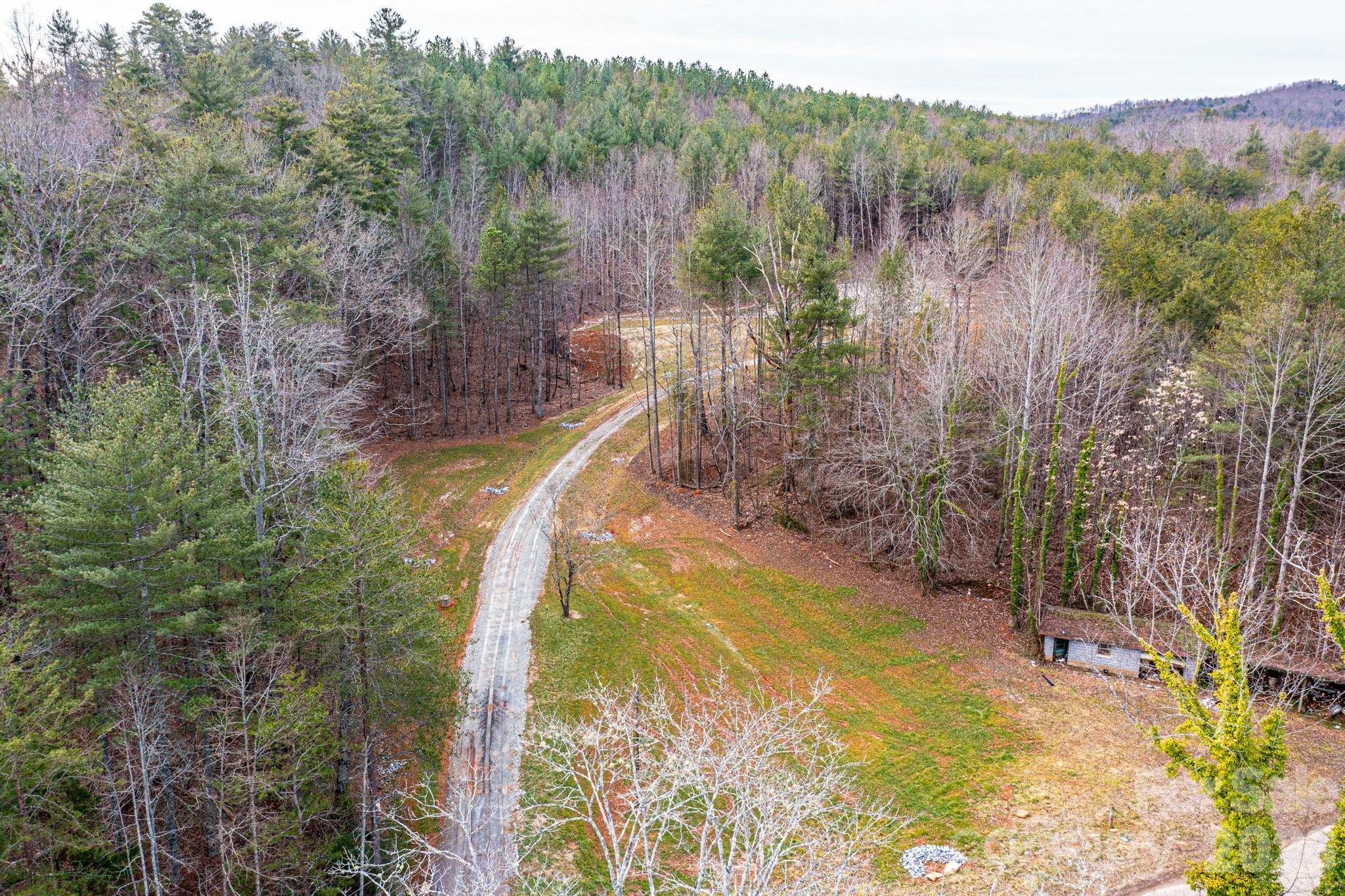 3941 Fox Winkler Road Lenoir, NC 28645 - Photo 7 of 20 a view of a lake with a mountain