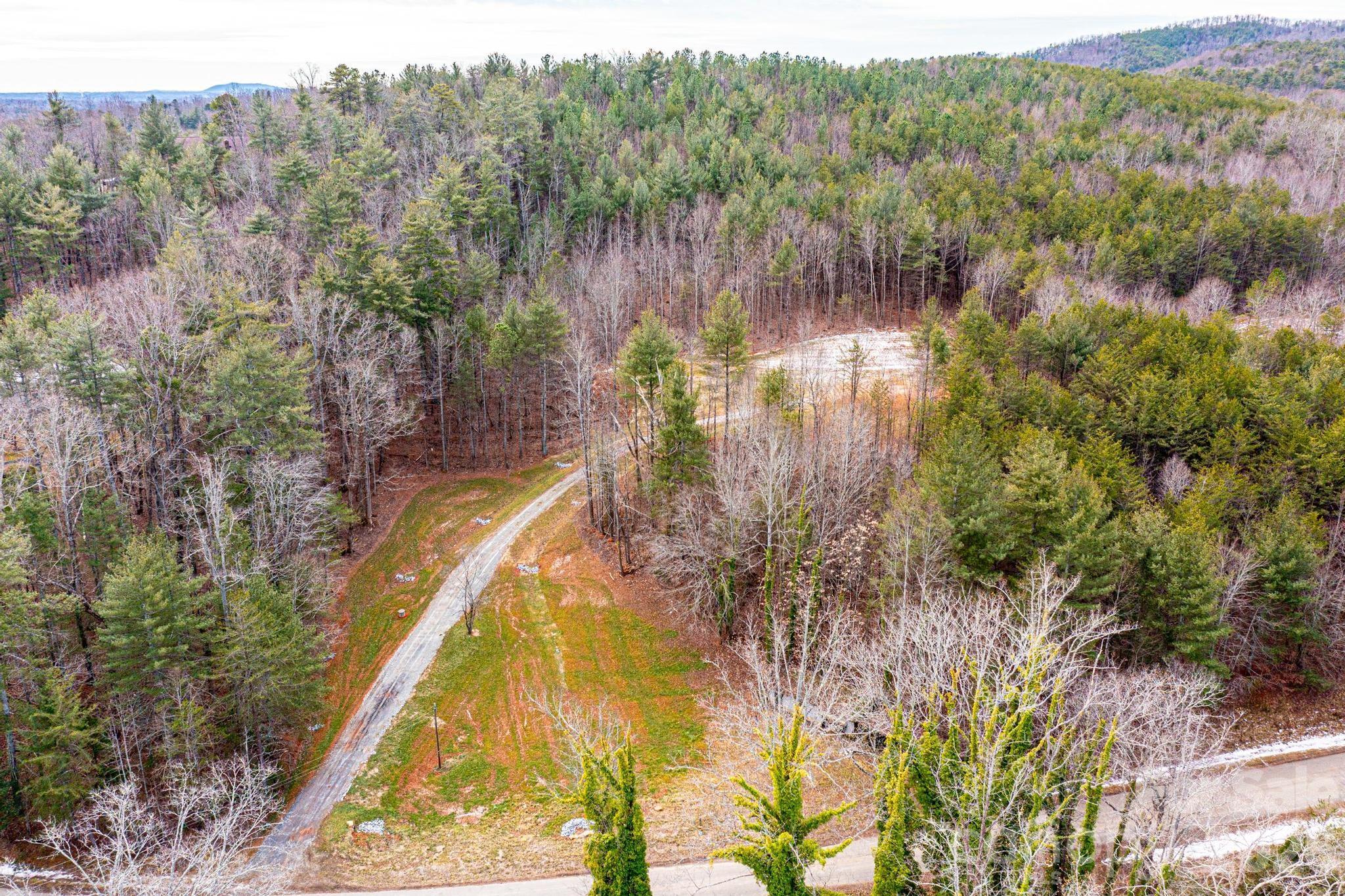 3941 Fox Winkler Road Lenoir, NC 28645 - Photo 8 of 20 a view of a lake in middle of the forest