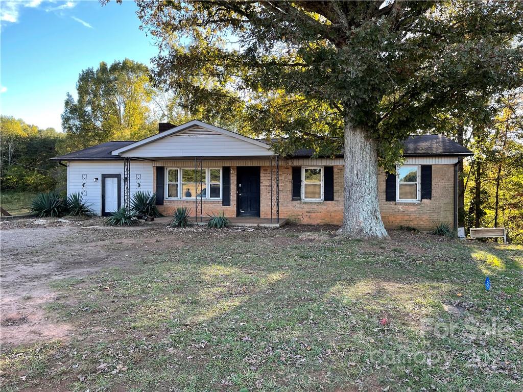 1354 Goble Road Hiddenite, NC 28636 - Photo 1 of 11 a front view of a house with yard and green space