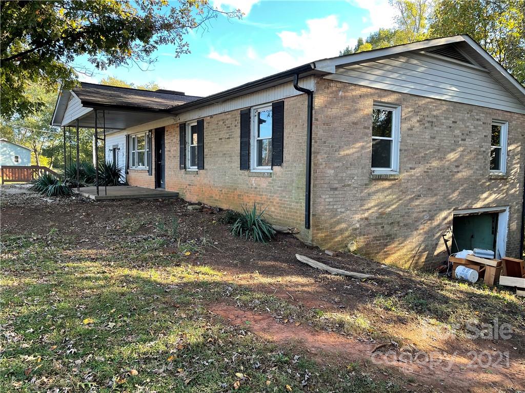 1354 Goble Road Hiddenite, NC 28636 - Photo 4 of 11 a front view of a house with a yard