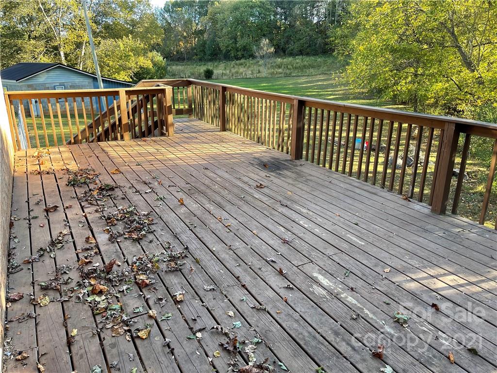 1354 Goble Road Hiddenite, NC 28636 - Photo 6 of 11 a balcony with trees in front of it
