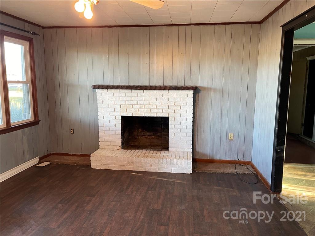 1354 Goble Road Hiddenite, NC 28636 - Photo 7 of 11 a living room with a fireplace