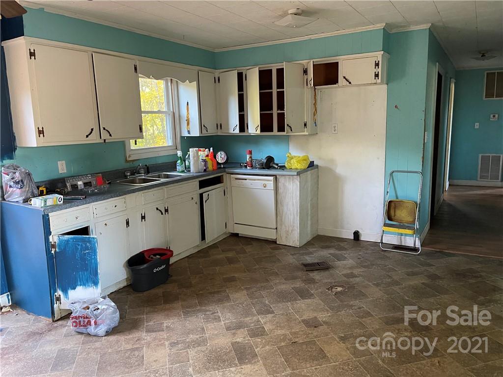 1354 Goble Road Hiddenite, NC 28636 - Photo 8 of 11 a kitchen with a sink cabinets and window