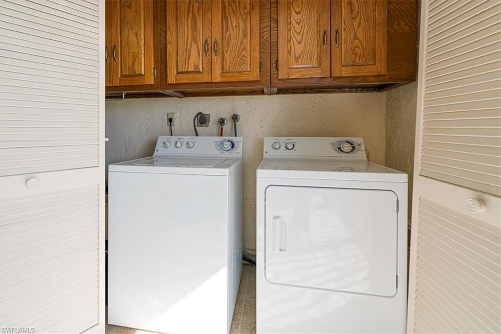 5515 Rattlesnake Hamm Road, Unit 301 Naples, FL 34113 - Photo 20 of 31 Laundry located in closet on Lanai