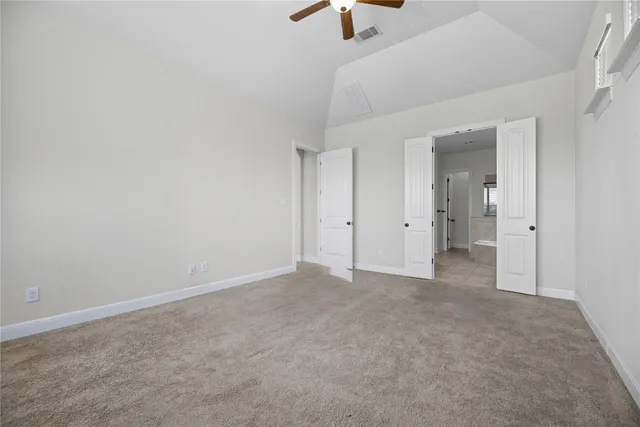 a bathroom with a tub a sink and mirror