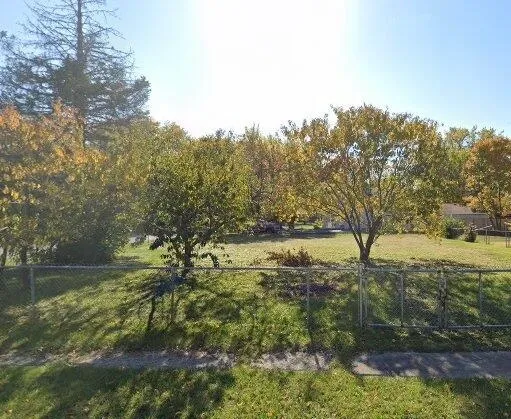 a view of a lake with houses in the back