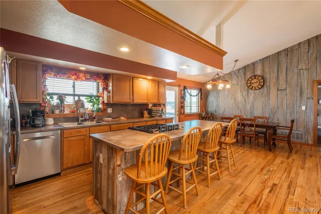 a room with lots of chairs and appliances
