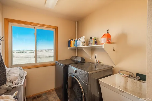 a storage room with washer and dryer