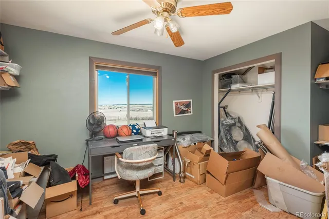 a living room with furniture a rug and white walls