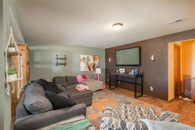a bathroom with a sink toilet and a mirror