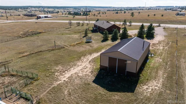 a aerial view of a house with a lake view