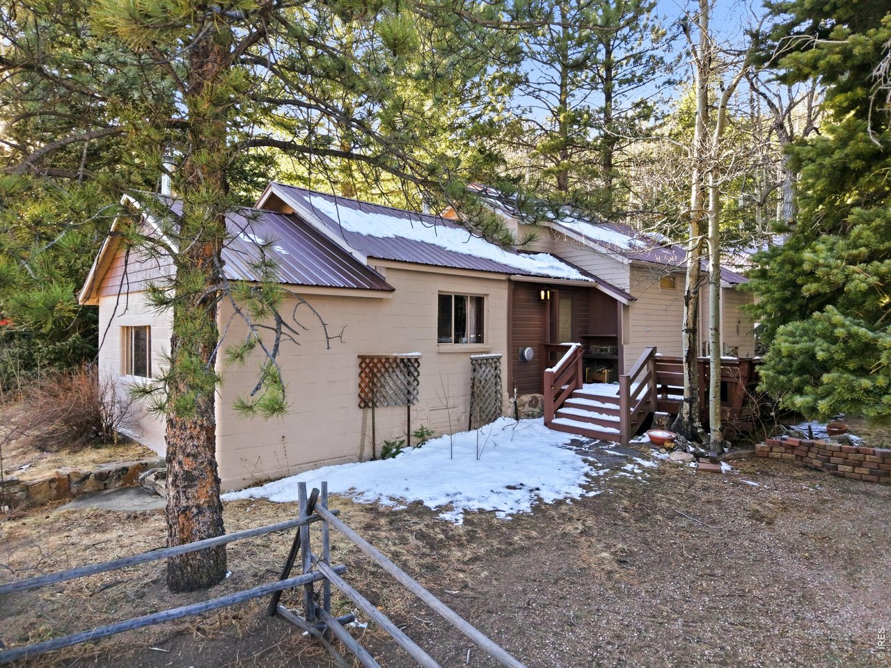 2476 Riverside Drive Lyons, CO 80540 - Photo 32 of 42 a view of a house with a patio