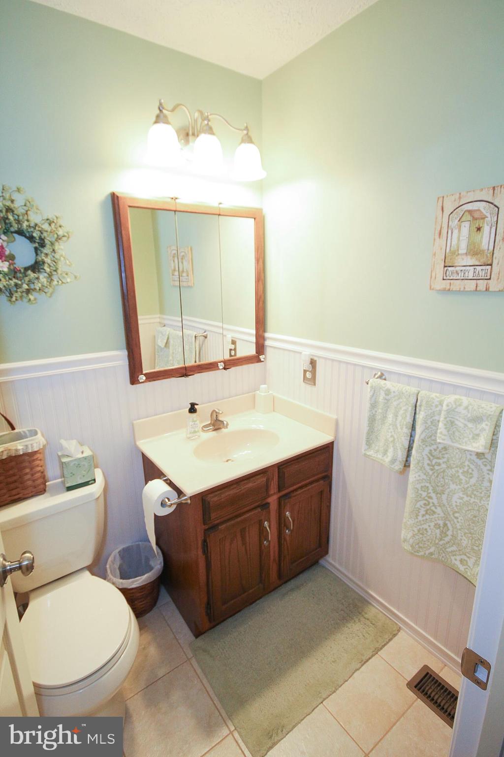 448 Inverness Road Williamstown, NJ 08094 - Photo 15 of 32 a bathroom with a sink mirror vanity and toilet