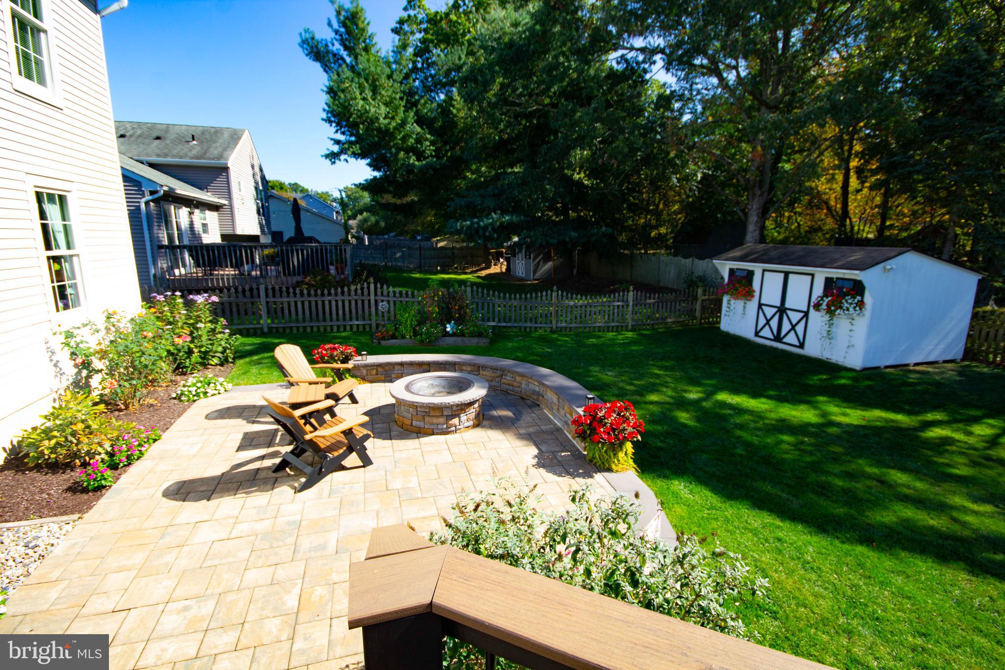 448 Inverness Road Williamstown, NJ 08094 - Photo 23 of 32 a view of a bench in a yard with potted plants