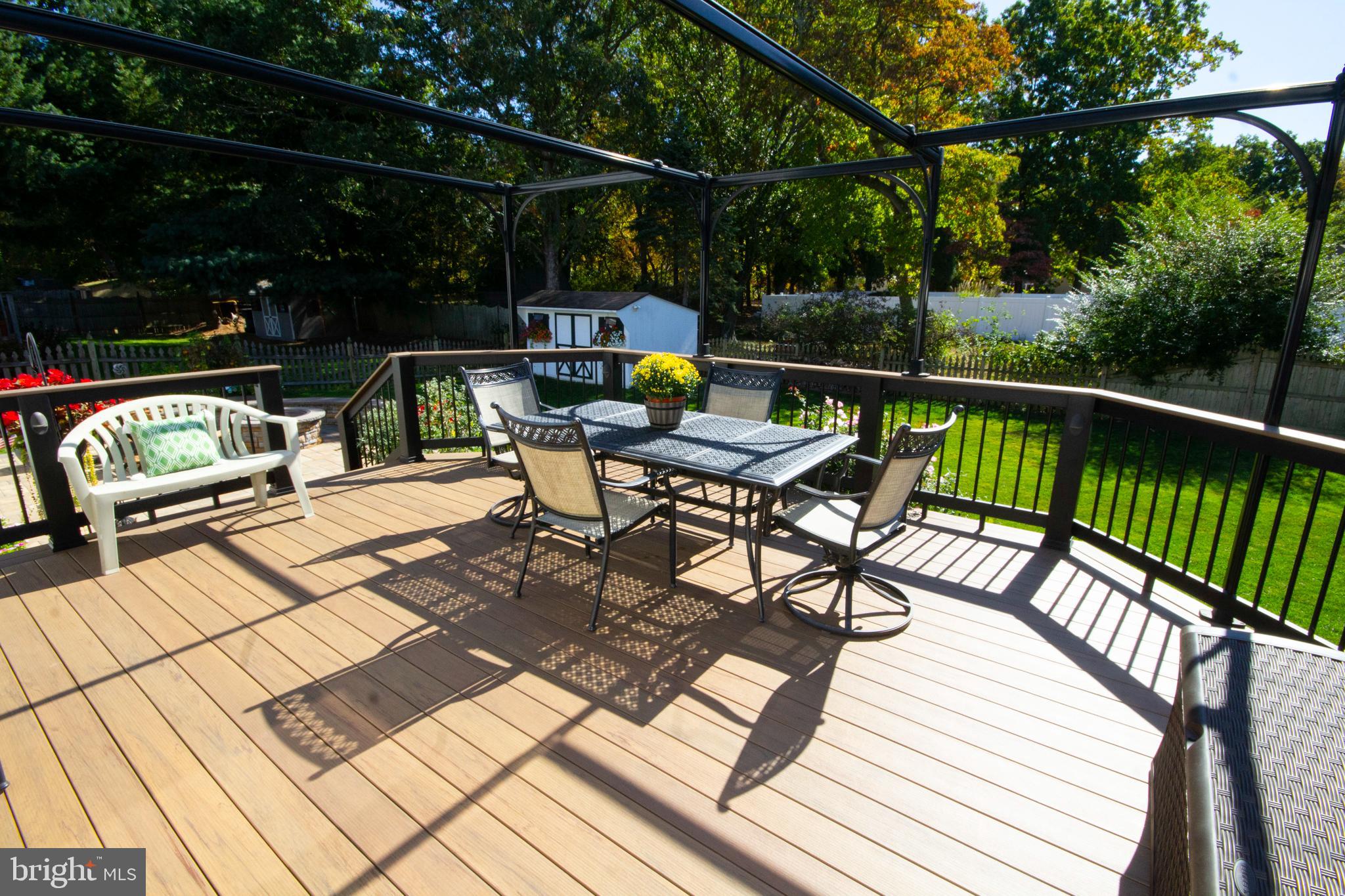 448 Inverness Road Williamstown, NJ 08094 - Photo 25 of 32 a view of a chairs and table on the wooden deck