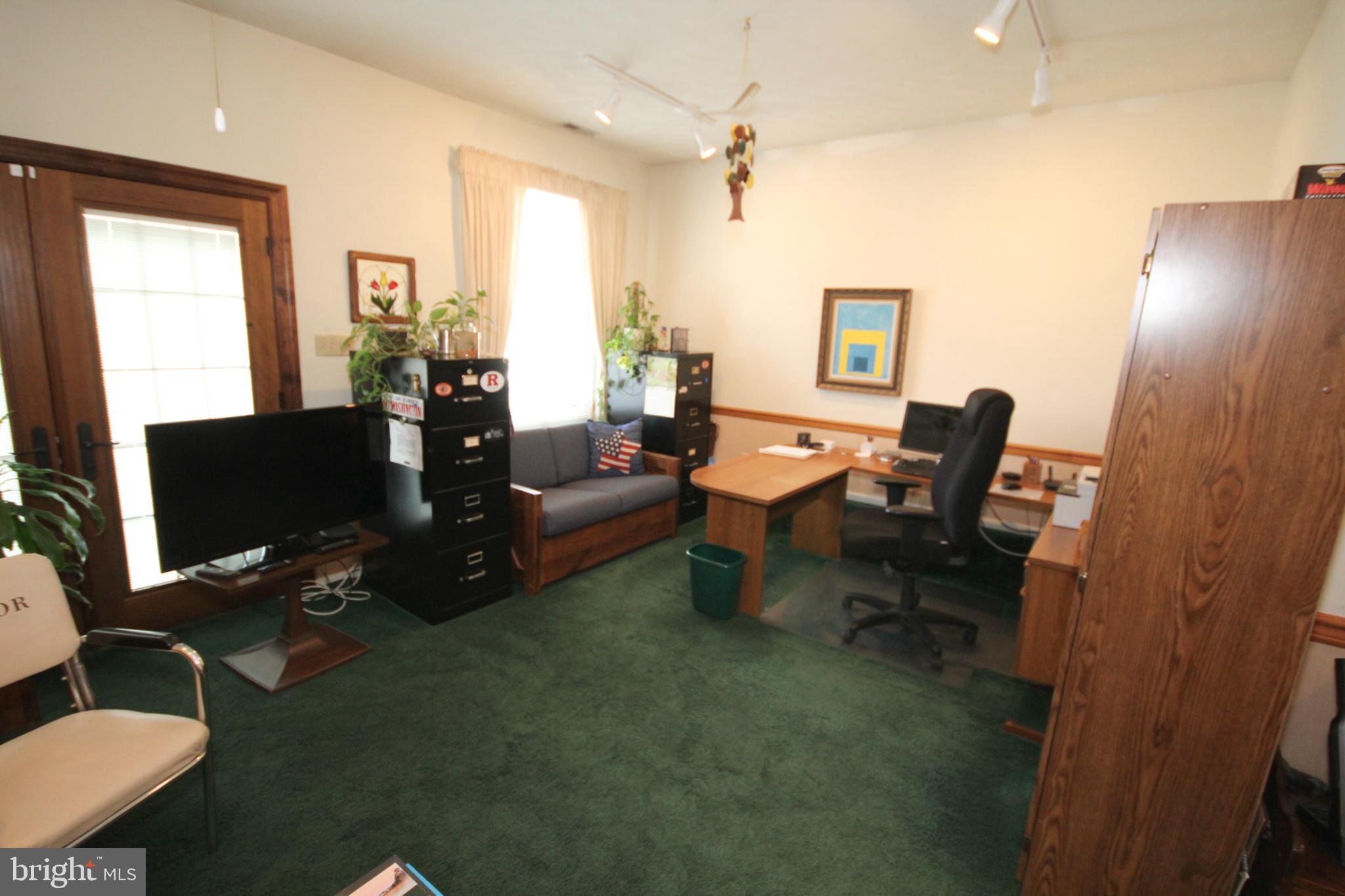 448 Inverness Road Williamstown, NJ 08094 - Photo 7 of 32 a living room with furniture wooden floor and a flat screen tv