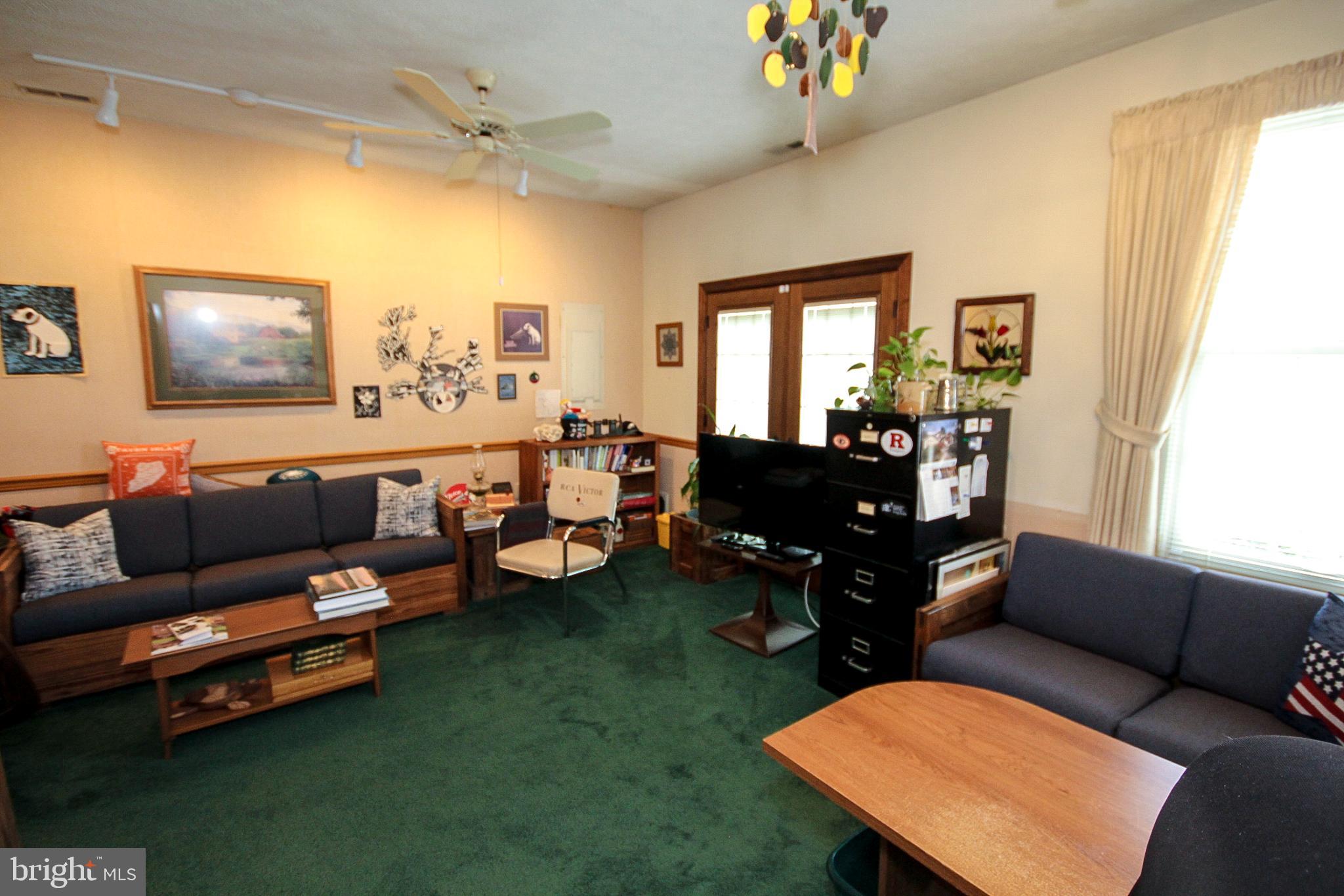448 Inverness Road Williamstown, NJ 08094 - Photo 8 of 32 a living room with furniture and a flat screen tv
