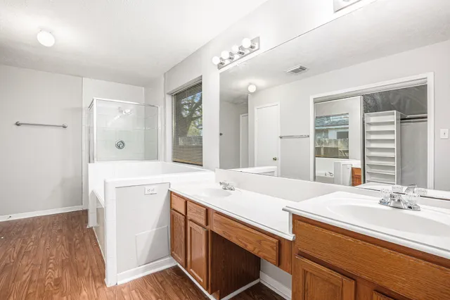 a bathroom with a sink double vanity and a mirror