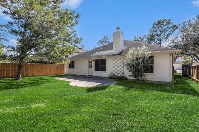 a backyard of a house with seating space