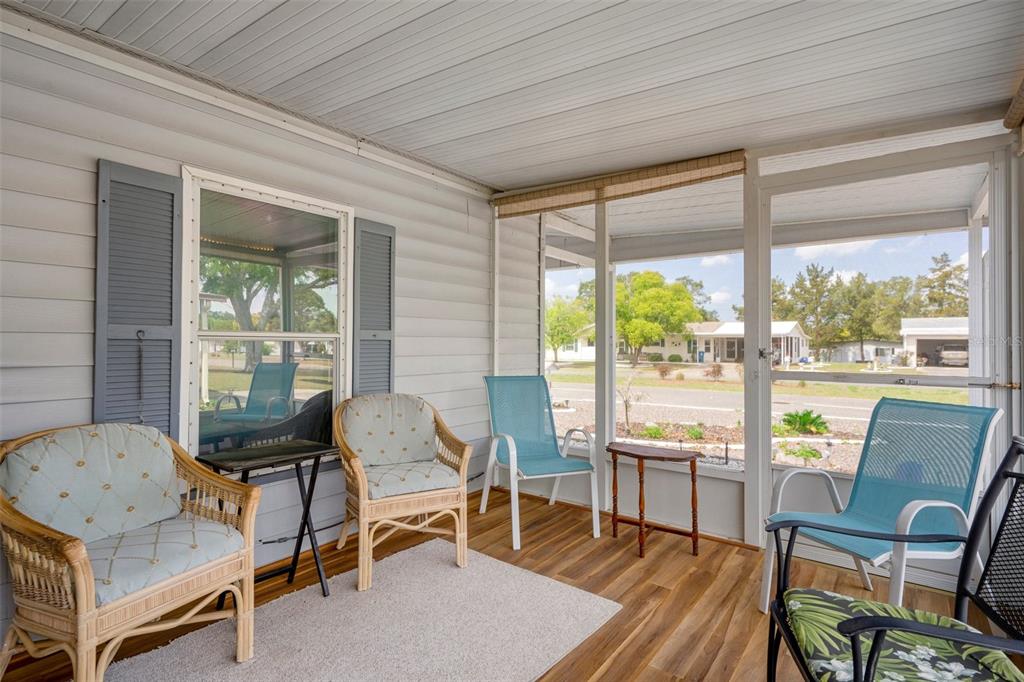 16203 Brookridge Boulevard Brooksville, FL 34613 - Photo 25 of 44 a living room with furniture and a large window