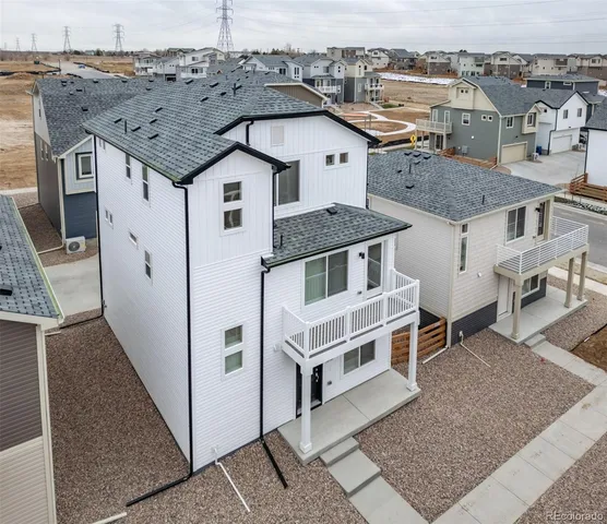 an aerial view of a house with a garage