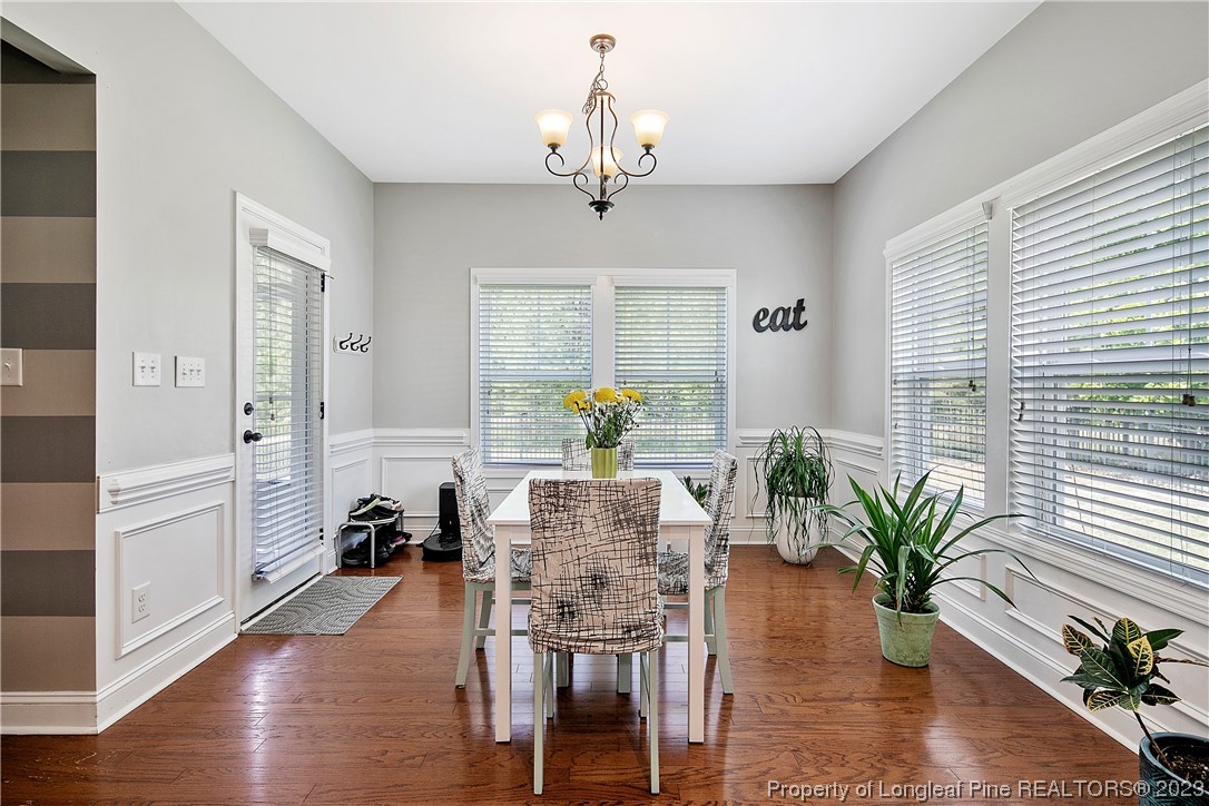 164 Valley Stream Road Spring Lake, NC 28390 - Photo 15 of 49 a view of a dining room with furniture window and wooden floor