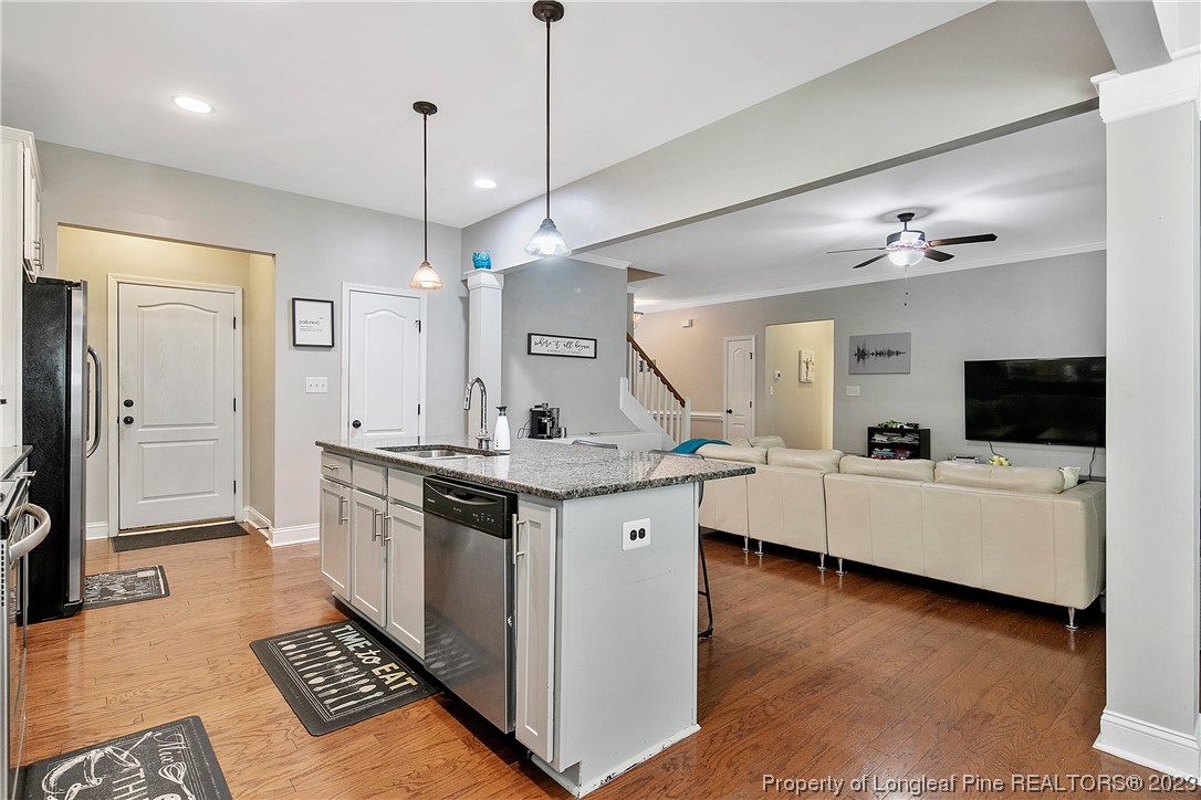 164 Valley Stream Road Spring Lake, NC 28390 - Photo 17 of 49 a large kitchen with a counter space a sink stainless steel appliances and cabinets