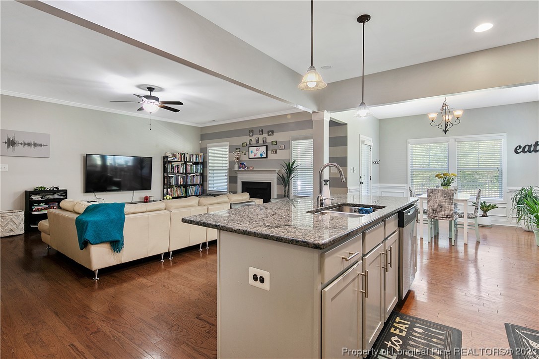 164 Valley Stream Road Spring Lake, NC 28390 - Photo 20 of 49 a kitchen with a counter space a sink appliances and a living room view