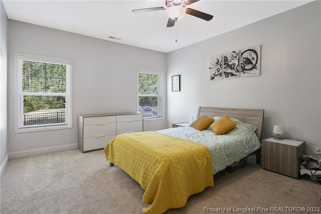 164 Valley Stream Road Spring Lake, NC 28390 - Photo 23 of 49 a bedroom with a bed and a window