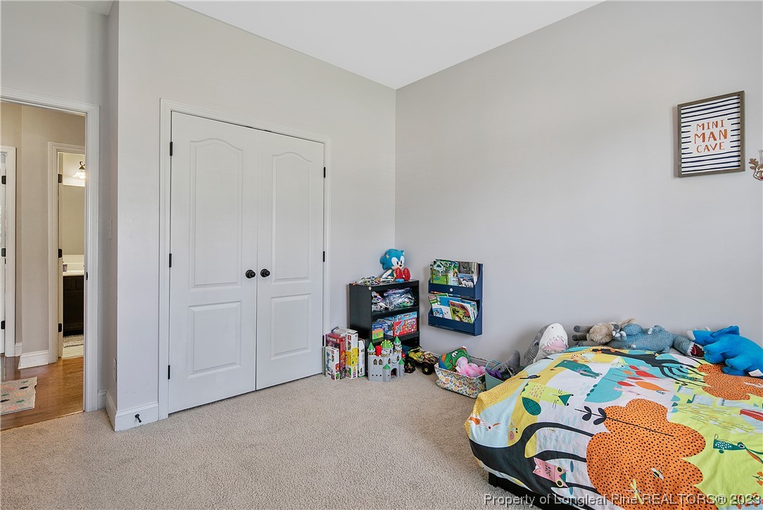 164 Valley Stream Road Spring Lake, NC 28390 - Photo 33 of 49 a bedroom with bed and a window