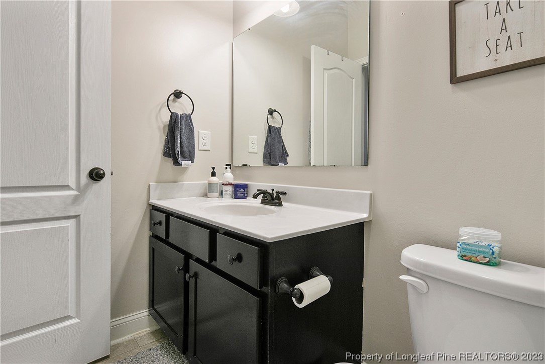 164 Valley Stream Road Spring Lake, NC 28390 - Photo 35 of 49 a bathroom with a sink and a toilet