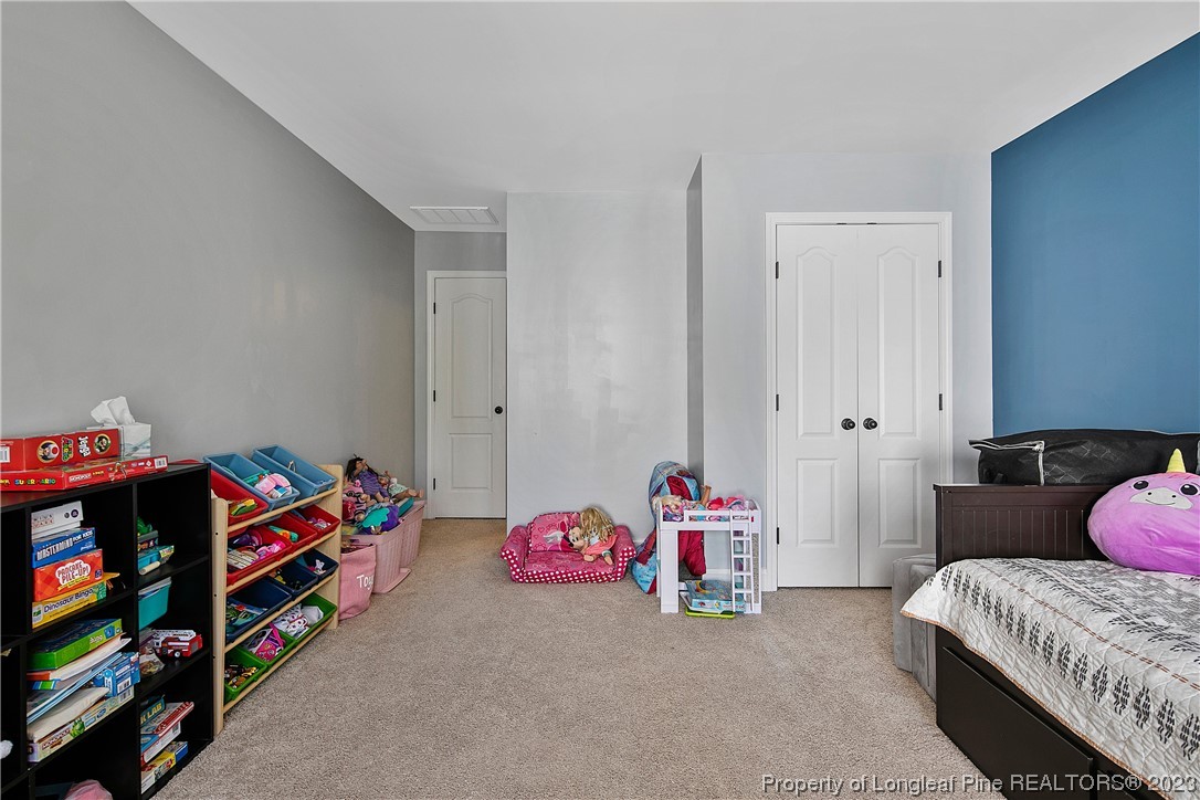 164 Valley Stream Road Spring Lake, NC 28390 - Photo 40 of 49 a bedroom with toys and a baby crib