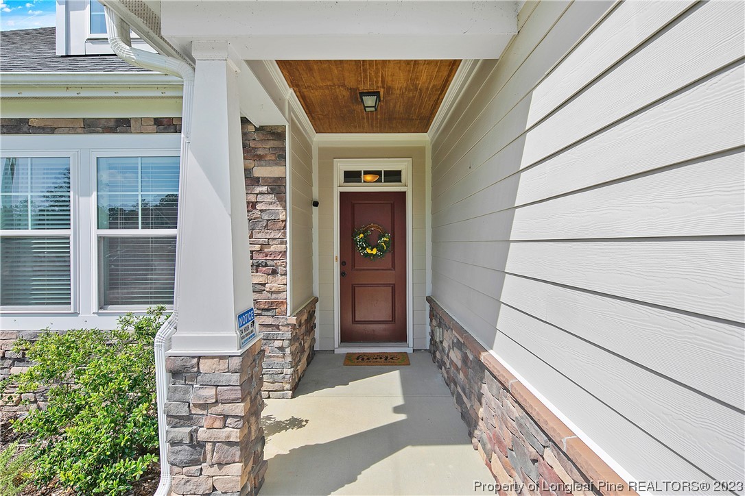164 Valley Stream Road Spring Lake, NC 28390 - Photo 4 of 49 a front view of a house with a blue gate
