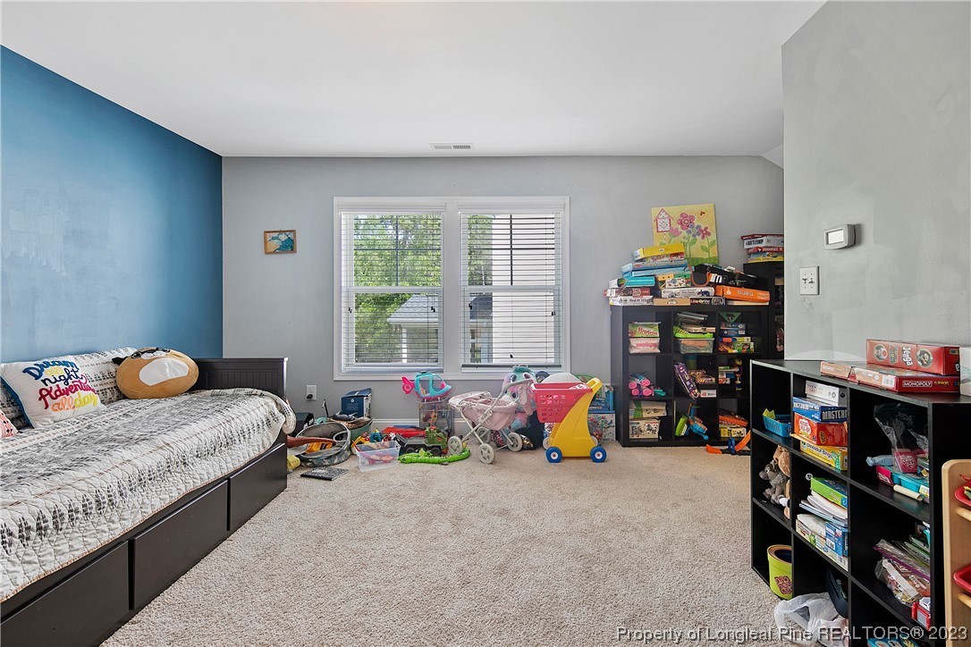 164 Valley Stream Road Spring Lake, NC 28390 - Photo 41 of 49 a bedroom with bed and a window