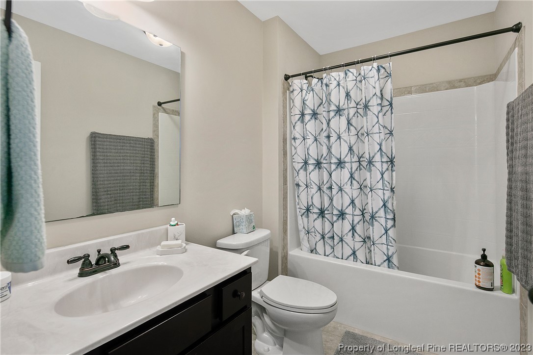 164 Valley Stream Road Spring Lake, NC 28390 - Photo 42 of 49 a bathroom with a sink toilet and shower