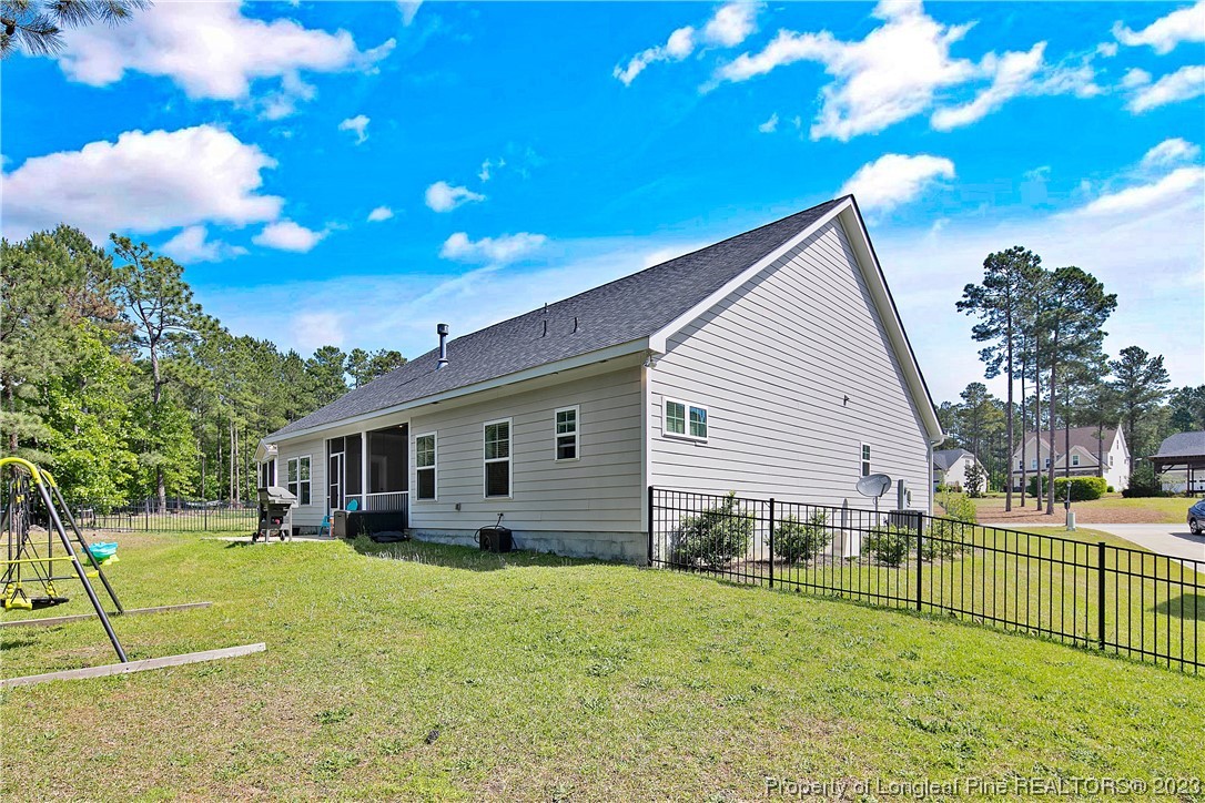 164 Valley Stream Road Spring Lake, NC 28390 - Photo 46 of 49 a view of a house with a backyard