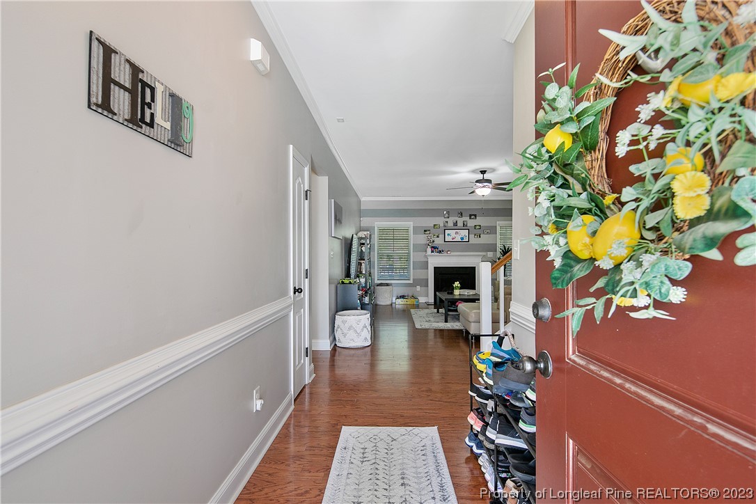 164 Valley Stream Road Spring Lake, NC 28390 - Photo 5 of 49 a living room with furniture a fireplace and a potted plant