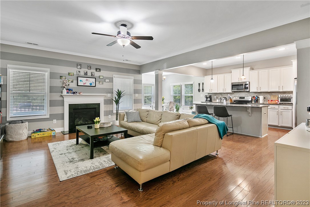 164 Valley Stream Road Spring Lake, NC 28390 - Photo 7 of 49 a living room with furniture and a fireplace
