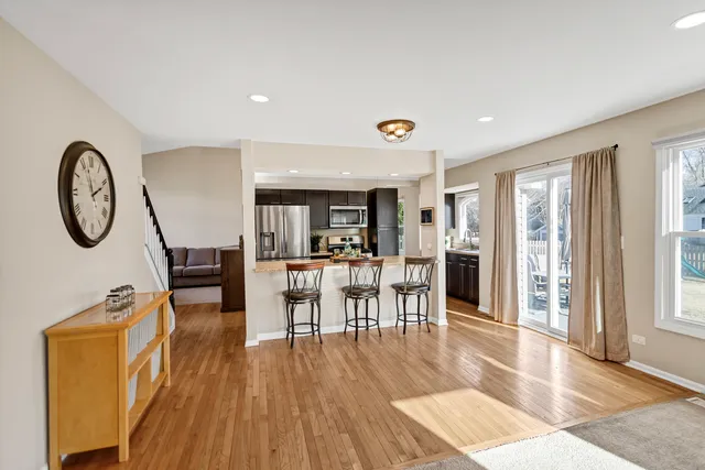 a view of dining room with furniture and wooden floor