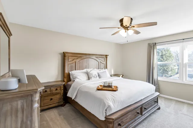 a bedroom with a bed and window