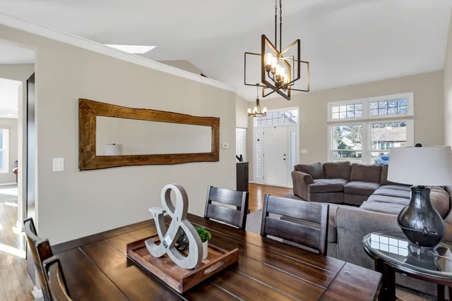a living room with furniture a couch and wooden floor