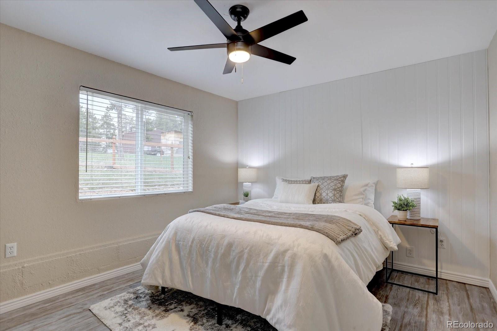 9288 Krashin Drive Conifer, CO 80433 - Photo 14 of 34 a bedroom with a bed and a window