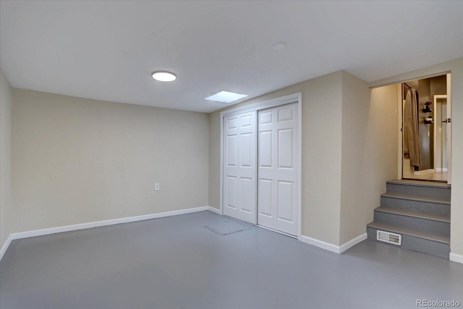 9288 Krashin Drive Conifer, CO 80433 - Photo 19 of 34 a view of an empty room with stairs and ventilation