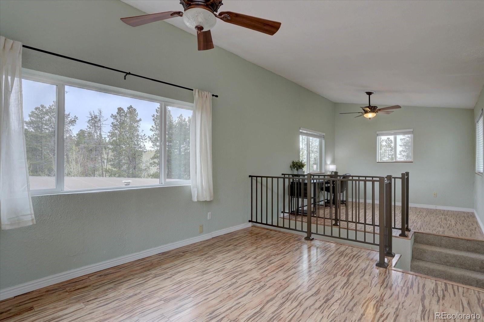 9288 Krashin Drive Conifer, CO 80433 - Photo 22 of 34 a view of entryway with wooden floor