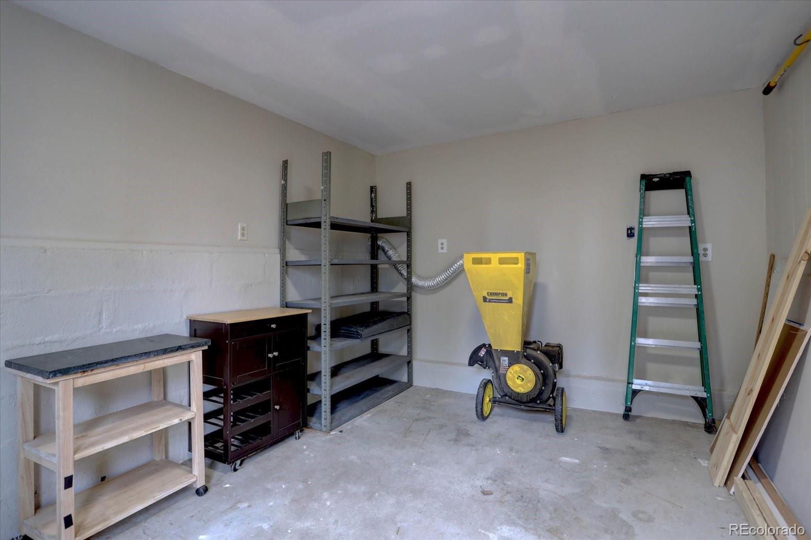 9288 Krashin Drive Conifer, CO 80433 - Photo 28 of 34 a bedroom with furniture and a window