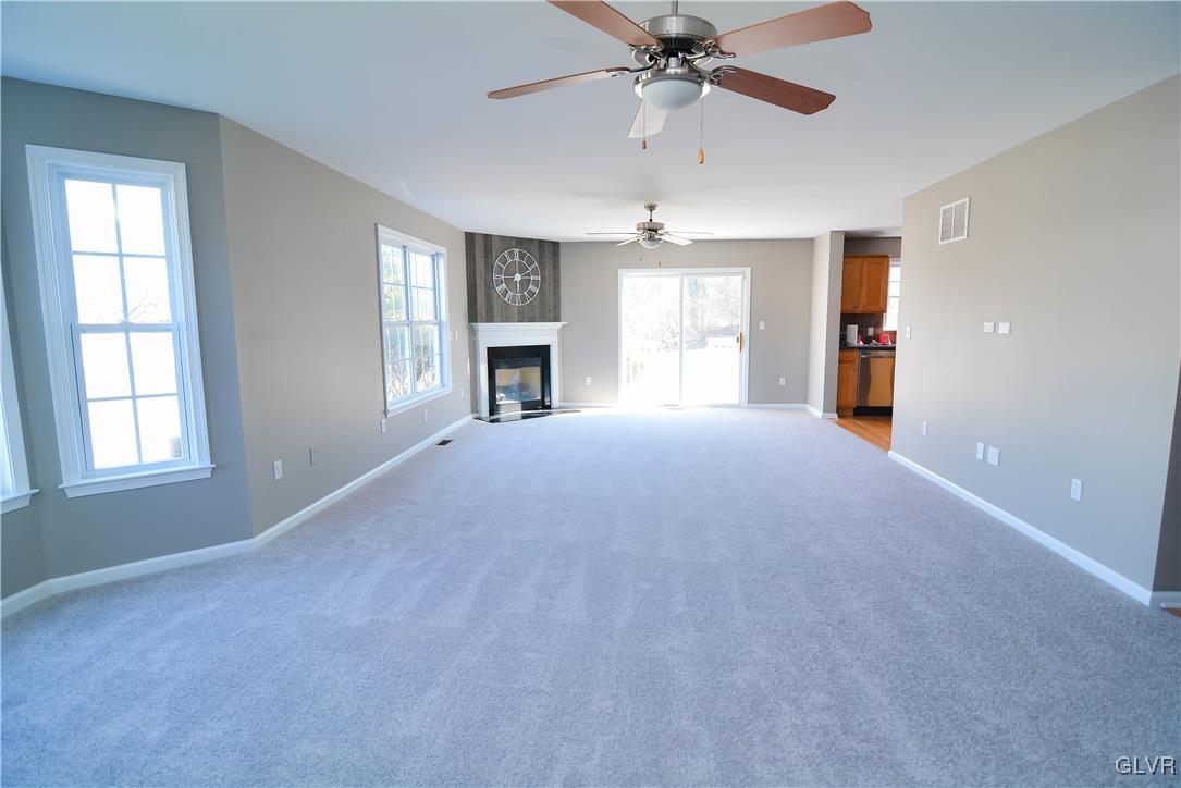 4190 Ross Road Bethlehem, PA 18020 - Photo 16 of 44 a view of a livingroom with a ceiling fan window and fireplace