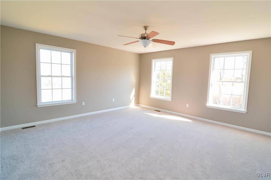 4190 Ross Road Bethlehem, PA 18020 - Photo 20 of 44 an empty room with windows and fan