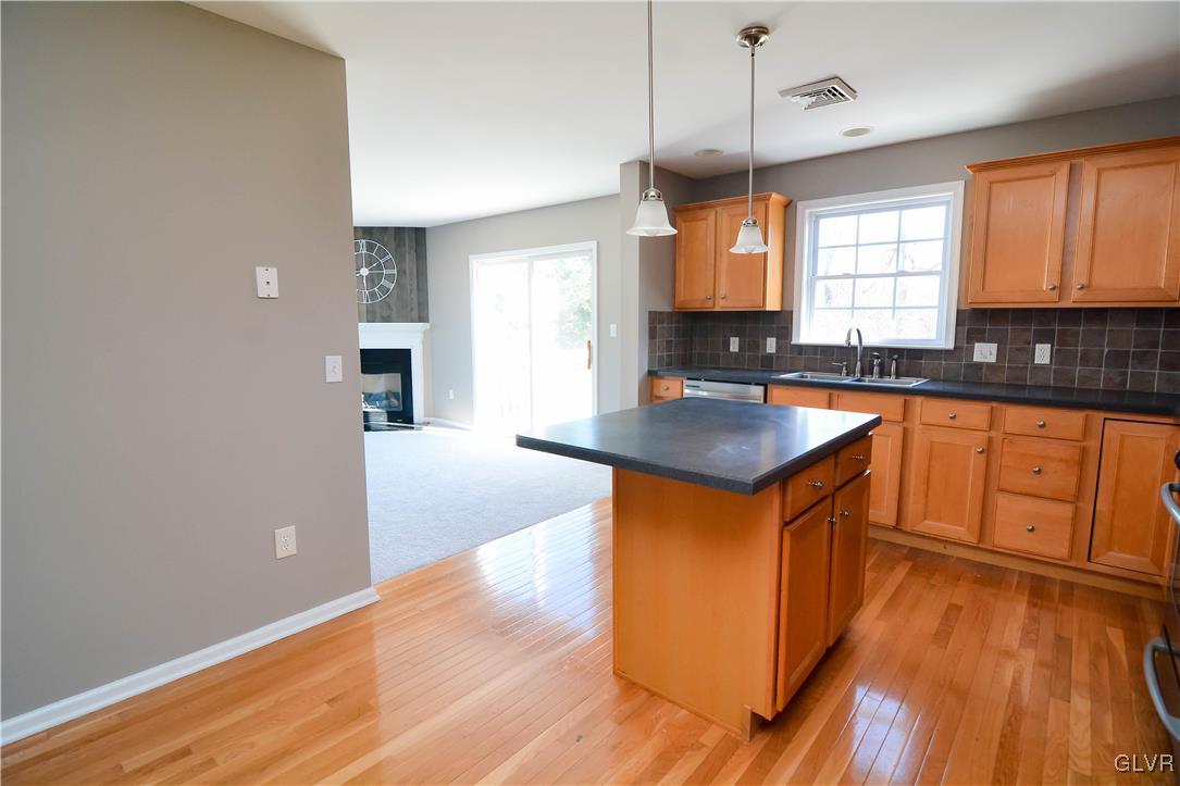 4190 Ross Road Bethlehem, PA 18020 - Photo 5 of 44 a kitchen with granite countertop a sink cabinets and wooden floor