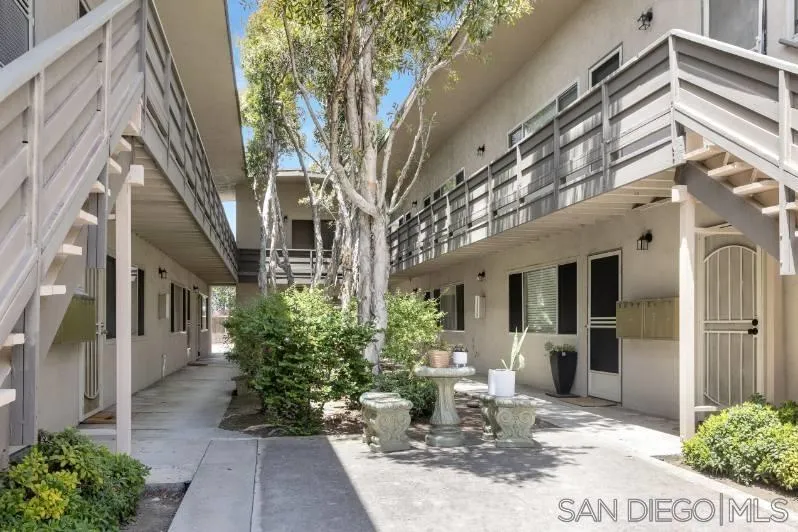 720 West Lewis Street, Unit 6 San Diego, CA 92103 - Photo 6 of 8 a view of a patio with couches table and chairs and potted plants